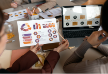 Marketing team reviewing predictive data models and customer behavior forecasts to support AI-driven marketing decisions in 2026